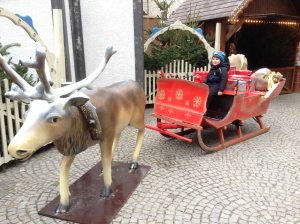 Luca riding the sleigh